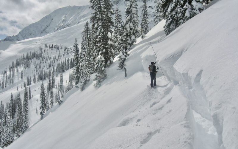 Measuring the avalanche crown where the snow slab breaks away form the snowpack above.